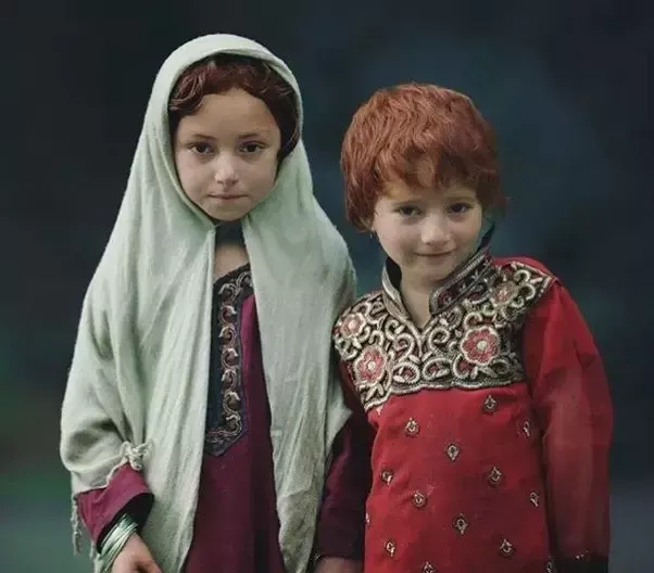 Two children in traditional Kashmiri dress
